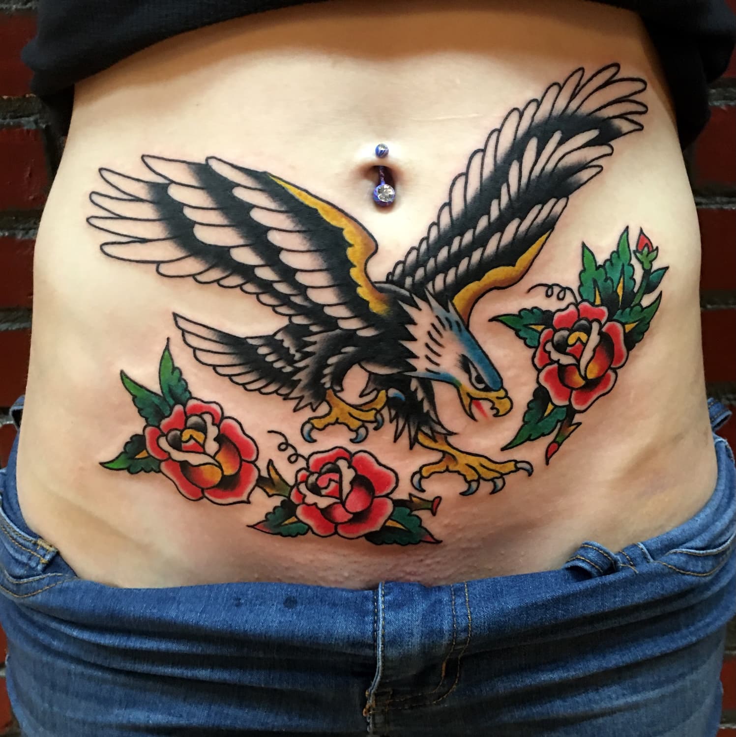 Tattoo of eagle with flowers