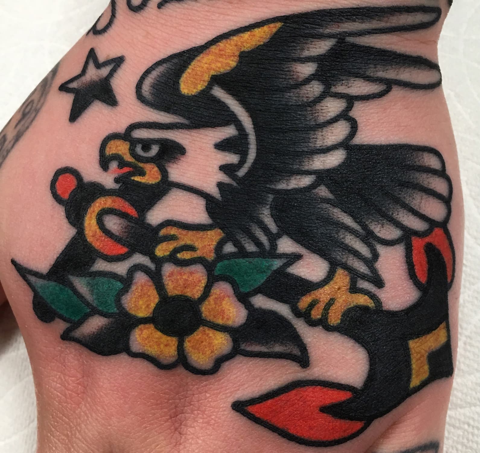 Tattoo of eagle on top of hand