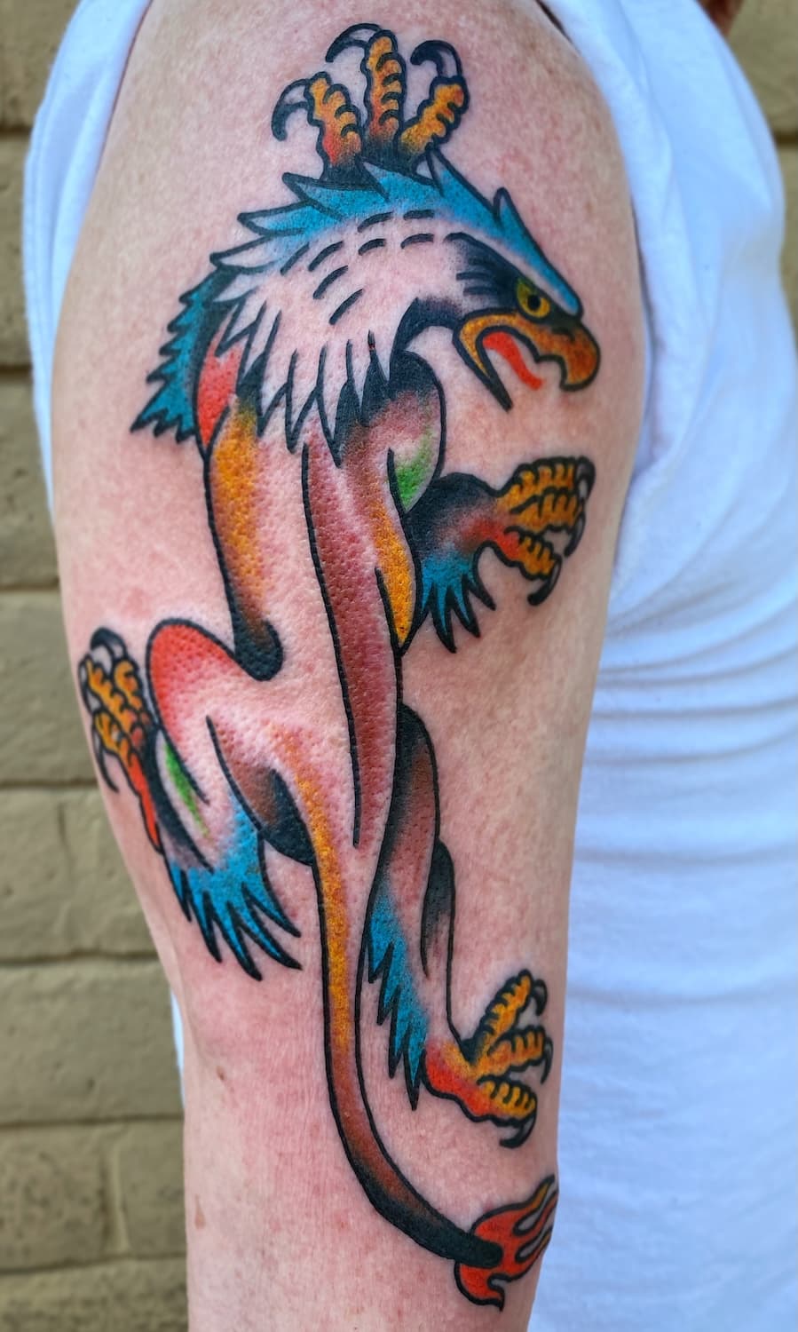 Tattoo of crawling panther with eagle head