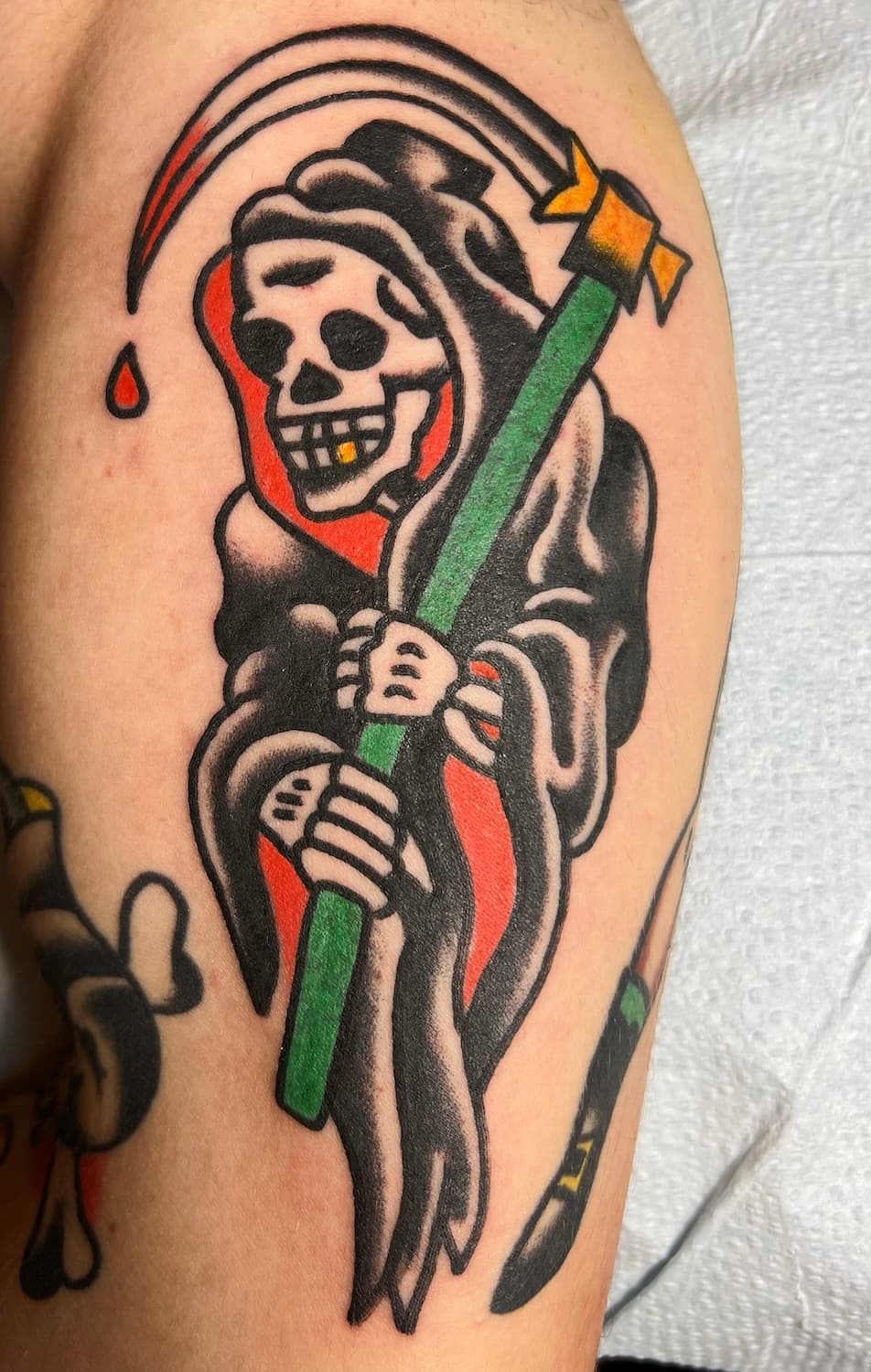 Tattoo of Grim Reaper on arm