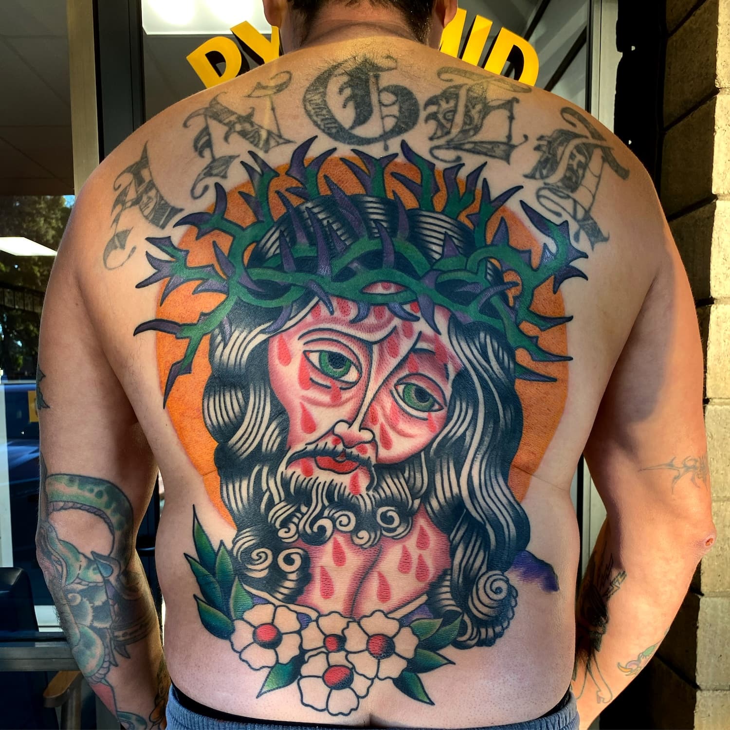 Tattoo of Jesus on back