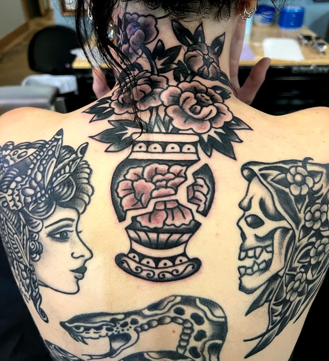 Tattoo of flowers in vase